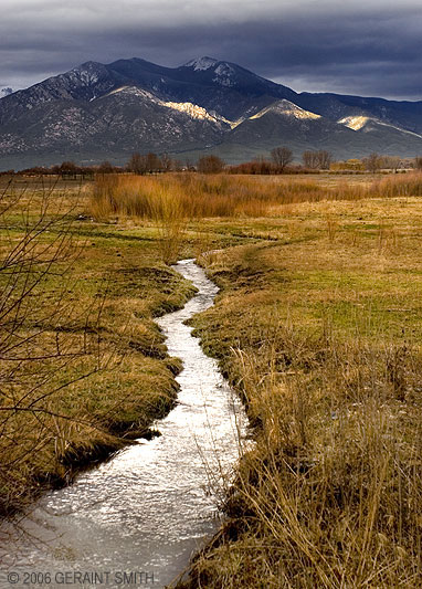 The water flowing in an irrigation ditch through the Ranchos valley in Taos, NM