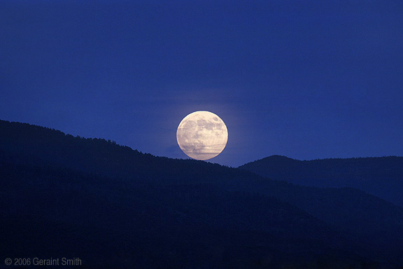 Harvest moon rise over Taos Pueblo, October 6th 2006