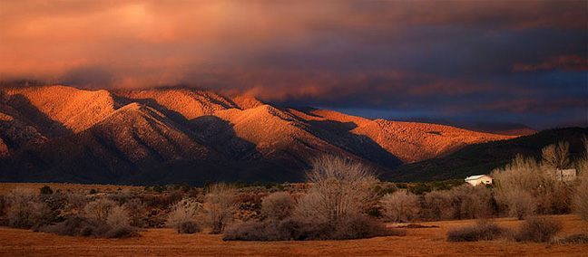 Winter sky and mountain sunset Taos, New Mexico Southwest USA