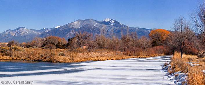 Taos Mountain and a frozen pond in Lower Ranchitos
