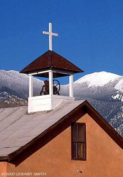 A little chapel on Highway 64 through El Prado, with a backdrop of Taos mountain, after a new snowfall.