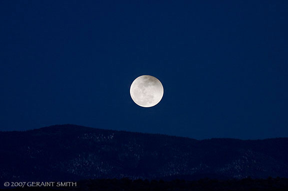 A partial eclipse of the moon on March 3rd as it rises over the Sangre de Cristos, Taos New Mexico
