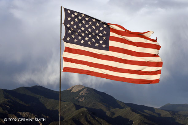 The big flag flying south of Taos, with Taos mountain in the background
