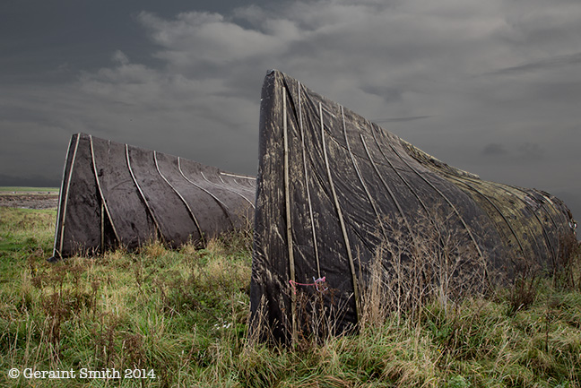Overturned fishing boats used now as storage sheds on the Holy Island of Lindisfarne