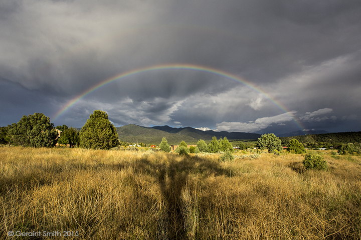 Rainbow over our meadow and shadow of the cottonwood tree in San Cristobal, NM Today is the 10 year anniversary of my website's photo of the day taos new mexico.