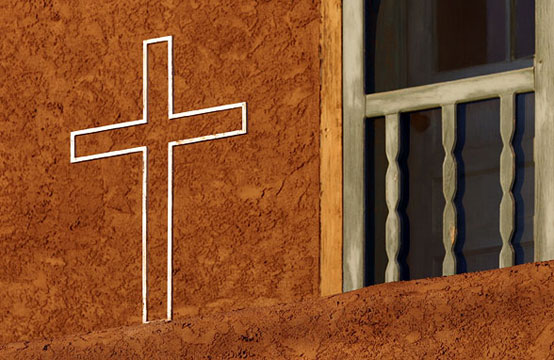 A Taos Composition, cross, adobe, door at Our Lady of Gaudalupe church in Taos New Mexico