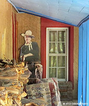2012 July 05, John Wayne on a porch under a portal in El Rito, NM
