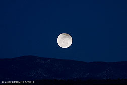 2007 March 04, A partial eclipse of the moon on March 3rd as it rises over the Sangre de Cristos, Taos New Mexico