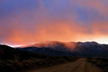 Winter sky, a road and early snows Taos, New Mexico