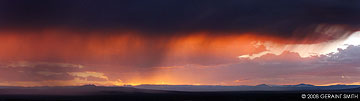 2008 September 02: A Taos sunset across the mesa through the rain