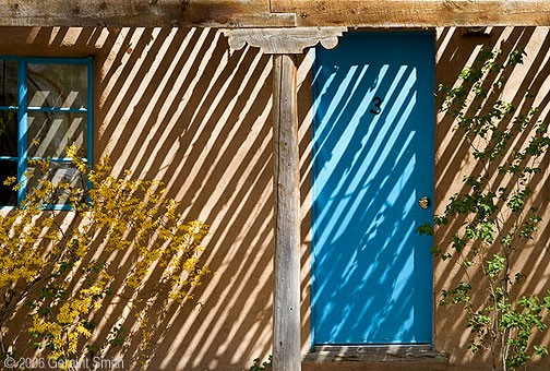 Adobe shadows on Kit Carson Road in Taos, New Mexico