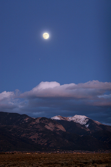 Mars and the Moon, View across the mesa to Arroyo Seco and Vallecito mountain near Taos New Mexico.