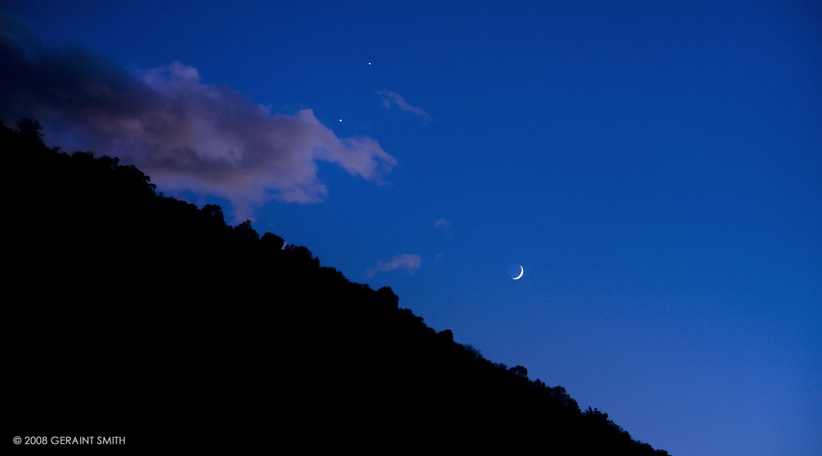 Venus and Jupiter conjuction, a waxing crescent moon and a few other celestial objects in the sky over Taos, NM