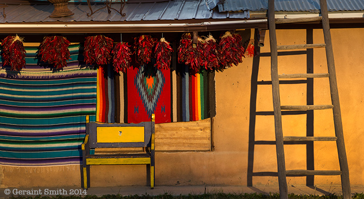 Evening light in El Prado, Taos, NM chilis ladder rugs blanket bench new mexico light toas