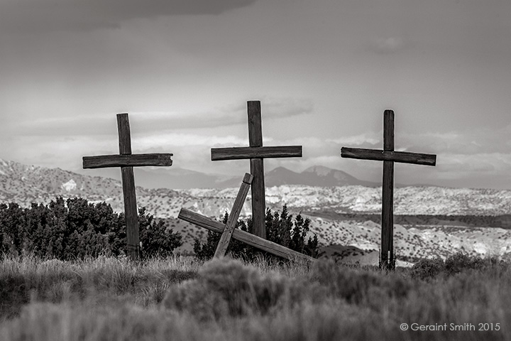 Three crosses at the Abiquiu Penitente Morada, with Pueblo Peak (Taos Mountain) as a backdrop