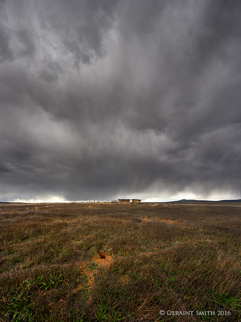 Storm brewing where the coyote roam three peaks carson new mexico mesa barns clouds