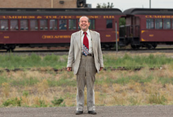2014 July 18  Mr John G. Andrews waiting on the train in Antonito, Colorado