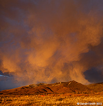 2015 March 29: Red truck under a Spring squall over the Sangre de Cristo foothills