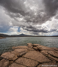 2015 May 05: Storm brewing and rain falling over Abiquiu Lake