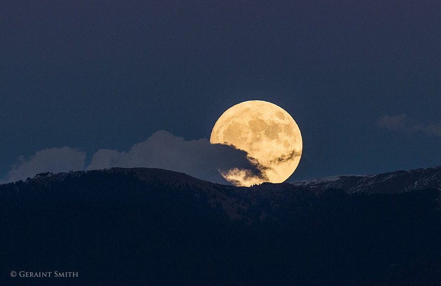 Super Moon rising over Vallecito Peak in the Sangre de Cristo Mountains, east of Taos New Mexico. 