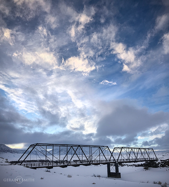 Lobatos steel bridge, crossing the frozen Rio Grande
