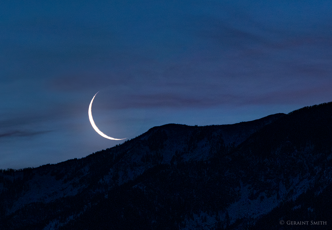 Crescent moon rise over Taos Mountain