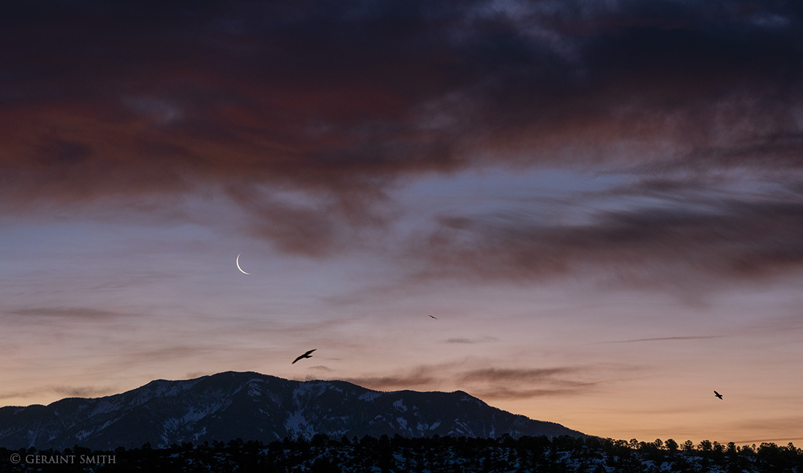 Crescent moon rise over Taos Mountain