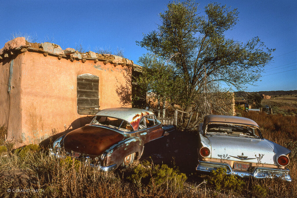 Old cars, and adobe, Galisteo, 1986