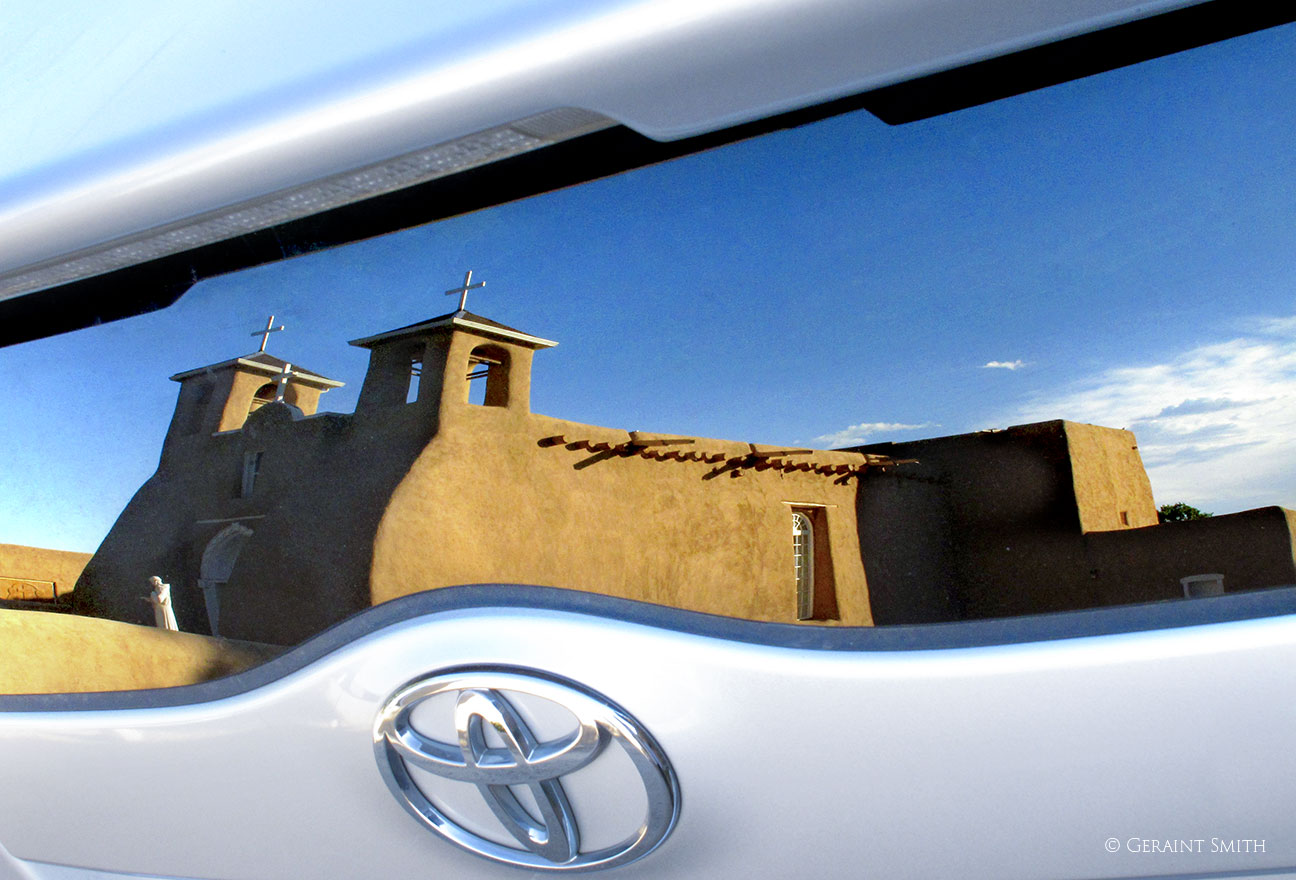 Saint Francis in the rear of an Toyota Prius
