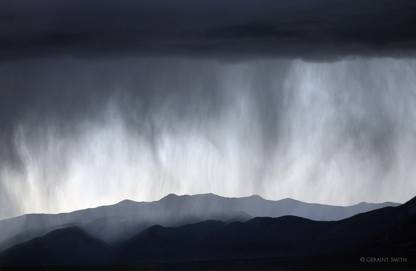 Walking rain, rain curtain, Taos mountains close up.