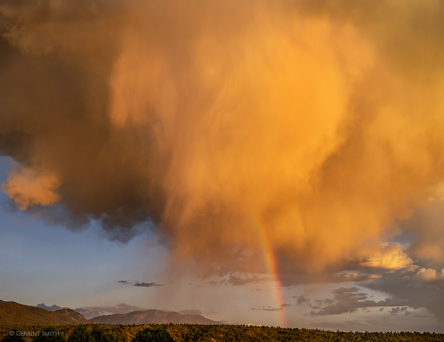 Rainbow storm cloud sunset San Cristobal, NM