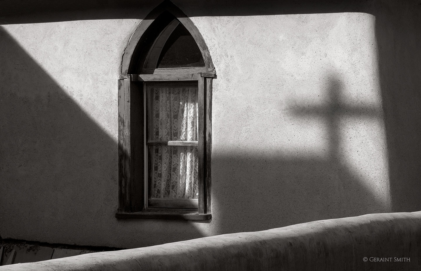 Arroyo Hondo shadows on church wall