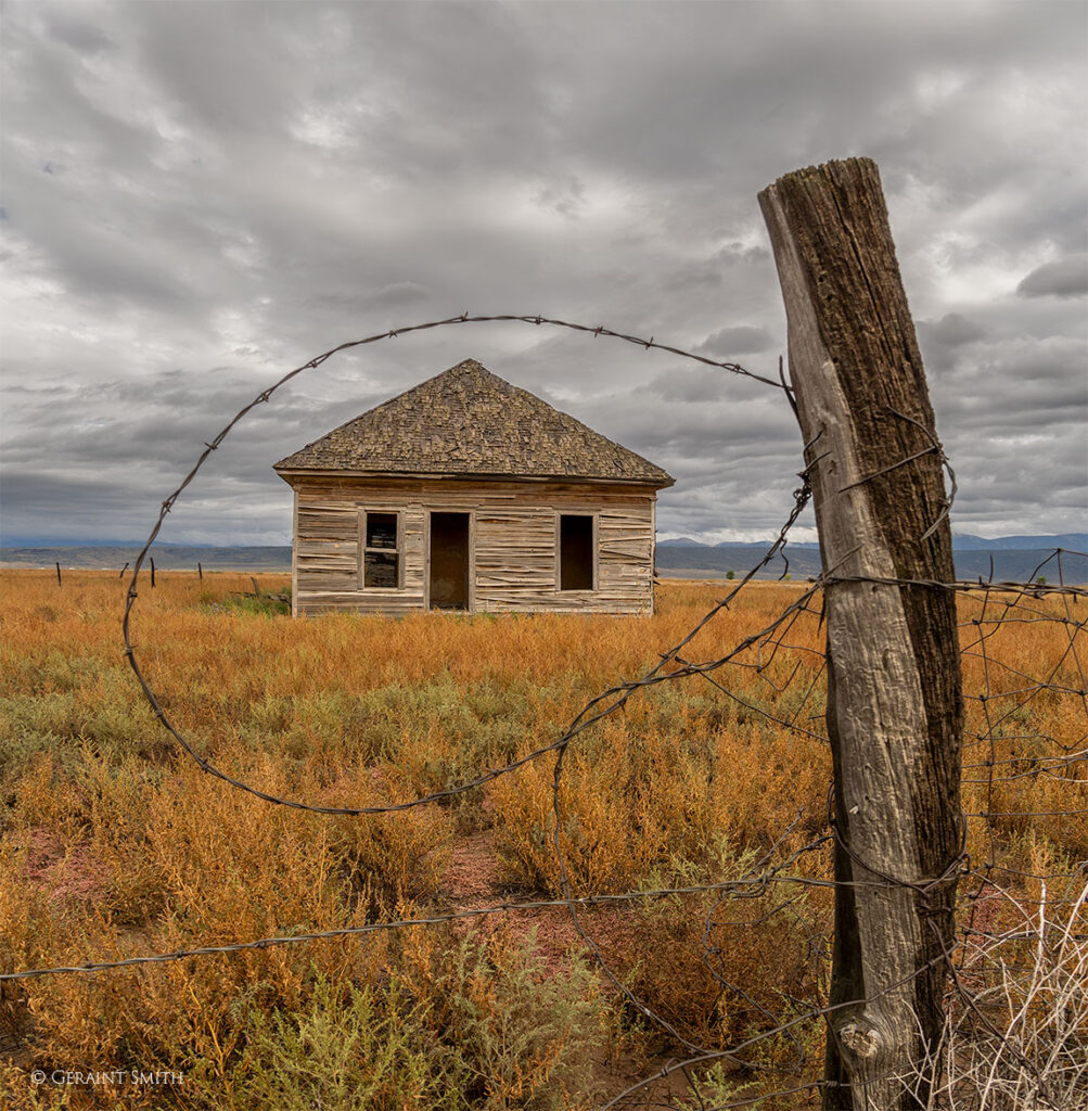 San Luis Valley homestead through the fence.