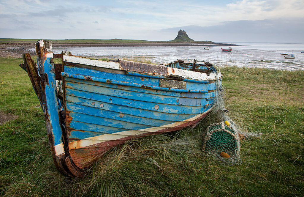 Boat with Lindisfarne castle