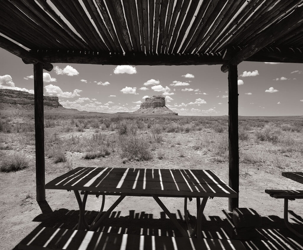 Chaco Canyon and Fajada Butte through a ramada picnic shelter.