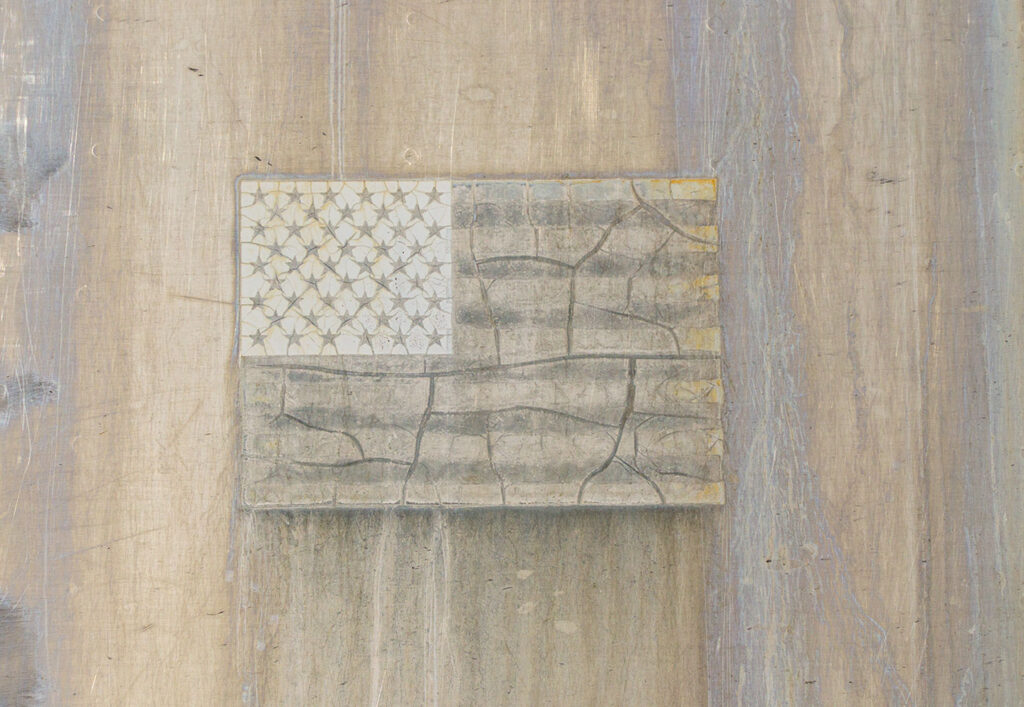 Faded flag emblem, Alamosa, railyards.