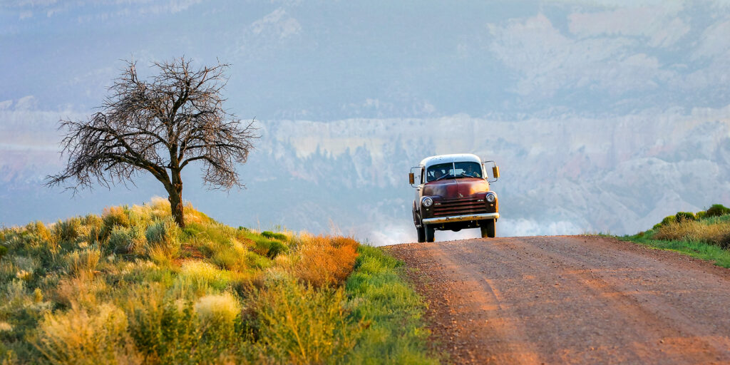 Panel truck on the Chama River road , NM