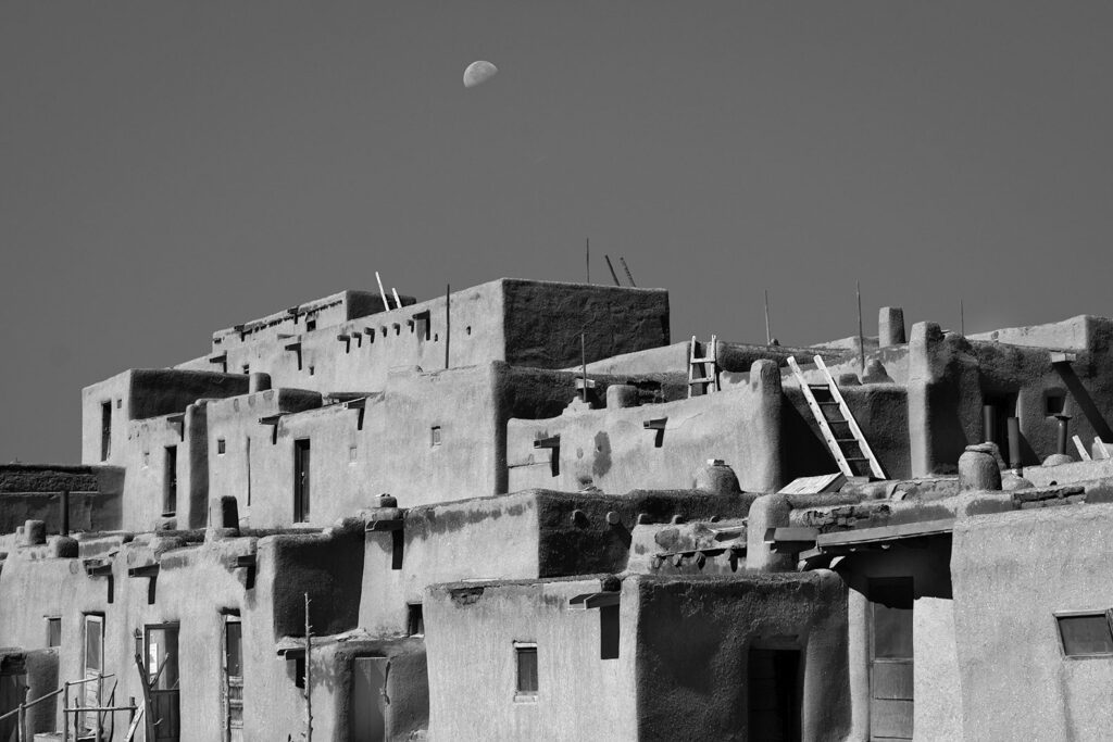 Taos Pueblo ladders and moon